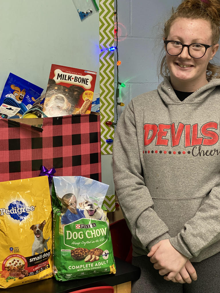 TMS student Ava Hanrahan with donated animal supplies