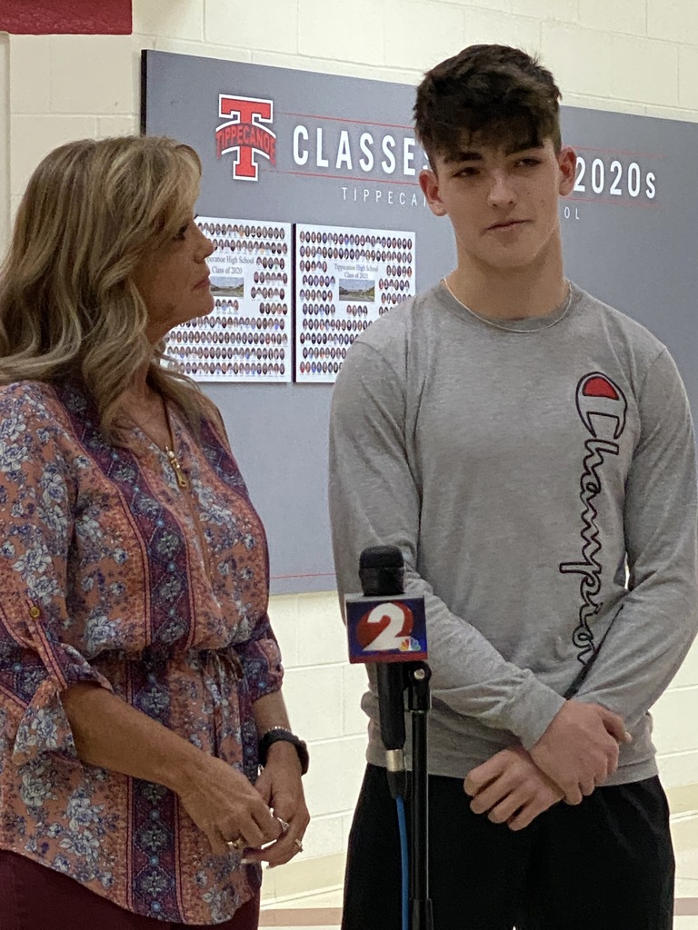 A THS student and his mom being interviewed by channel 2.
