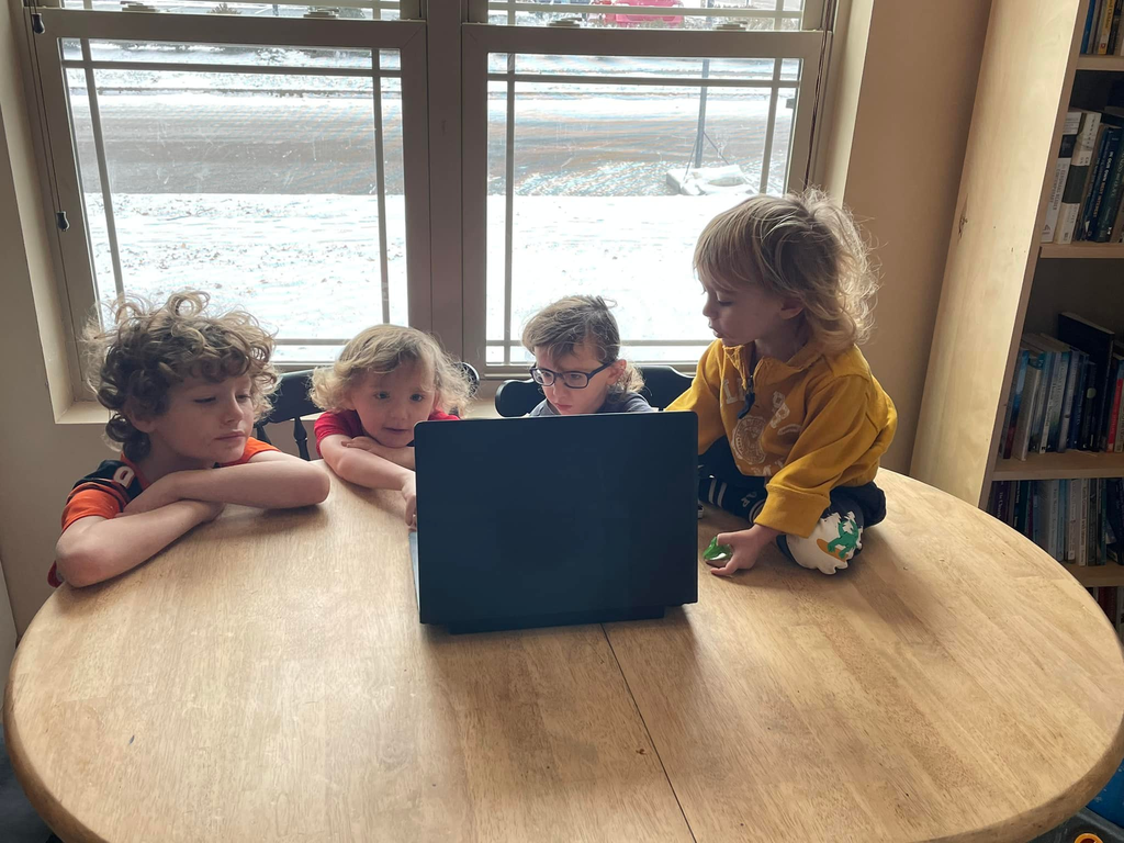 The children of teacher Emma McKenzie are at their computer for remoting learning