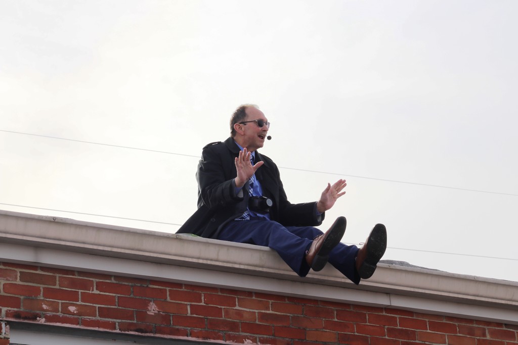 Mr. G sitting on the schools roof