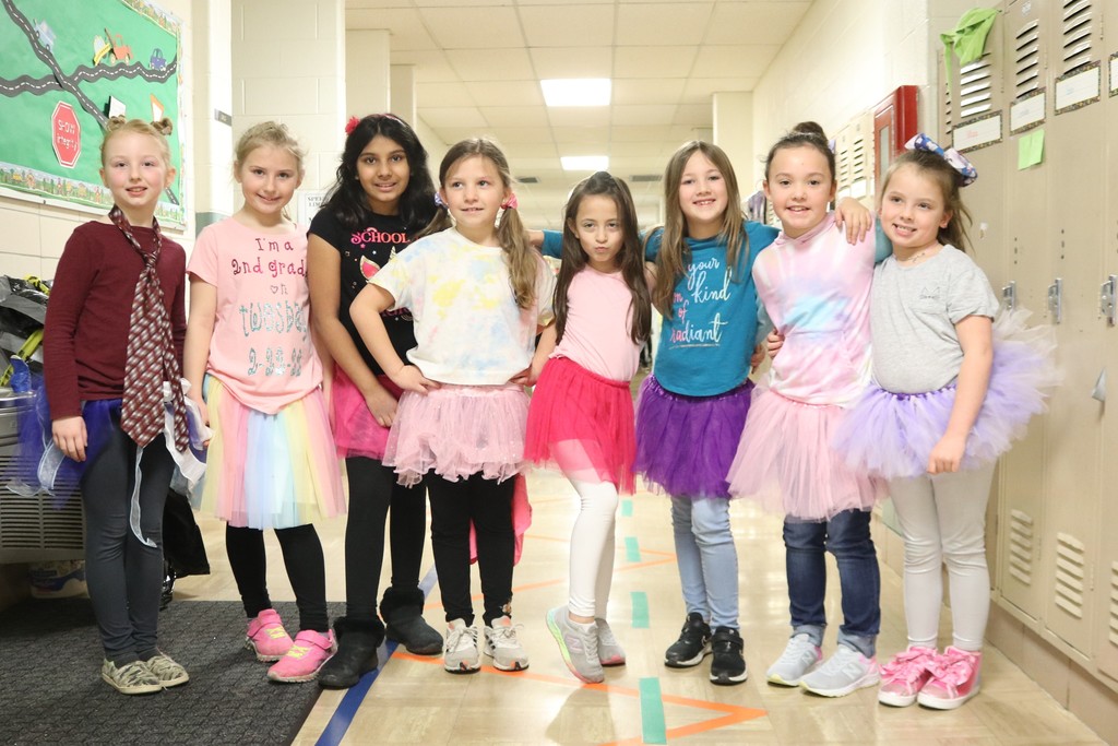 Several students with their tutus and smiles
