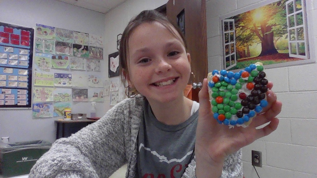 LT Ball student is happy with her cookie she decorated.