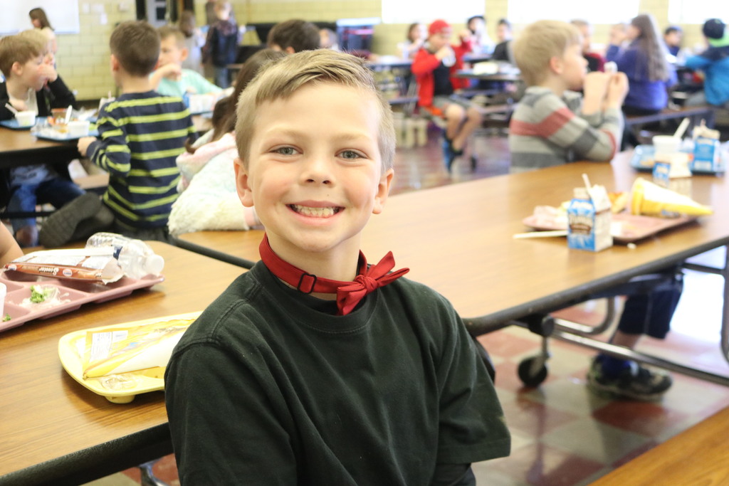 Happy student sporting his bowtie for Dr. Seuss birthday.