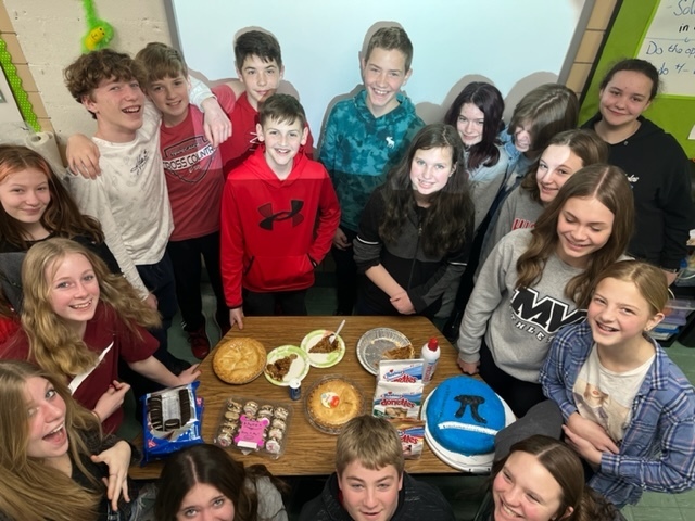TMS students show off their assortment of round treats for Pi Day