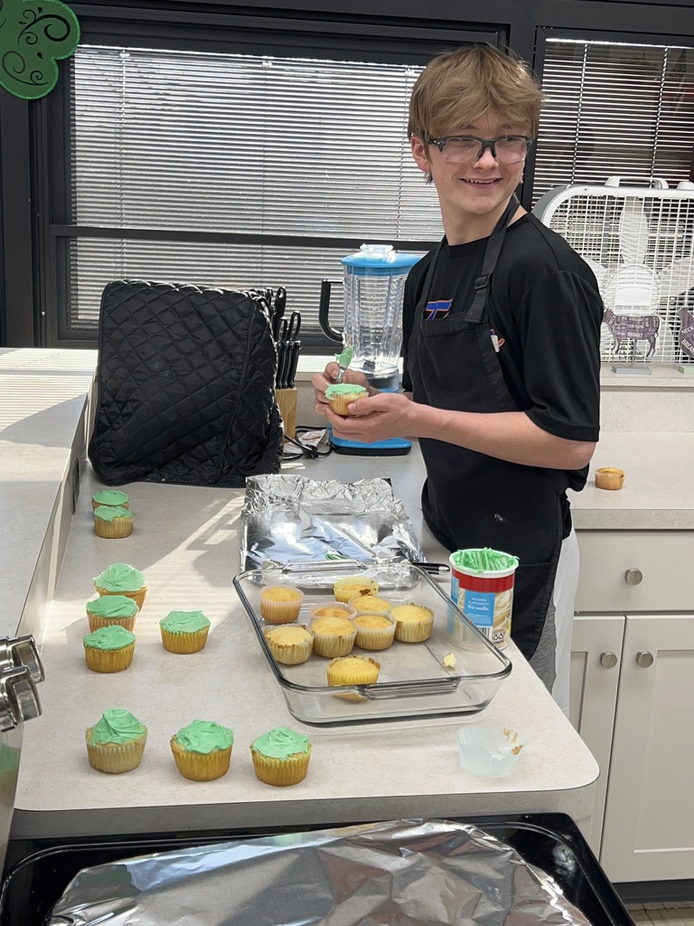 One student working in the classroom kitchen.
