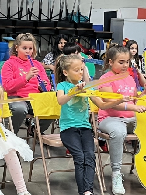 Broadway students with their pretend instruments.