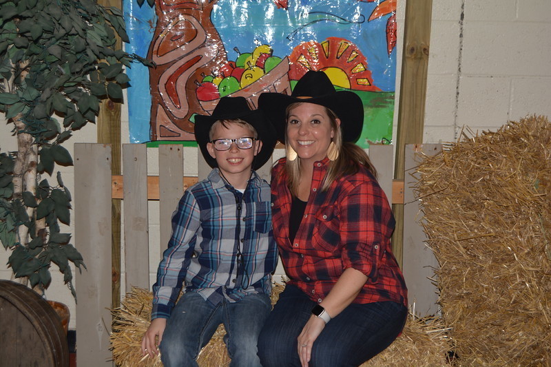 An LT Ball student and his mom pose for a picture at the Hoedown.