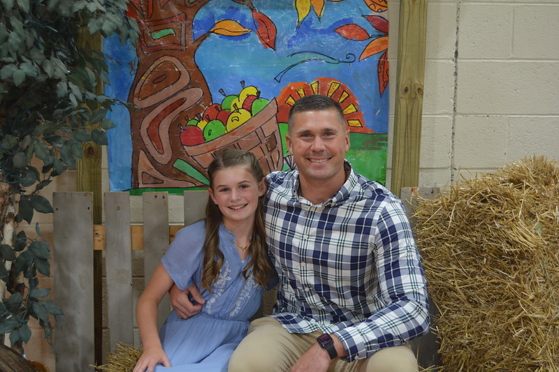 An LT Ball student and her dad smile at the hoedown.