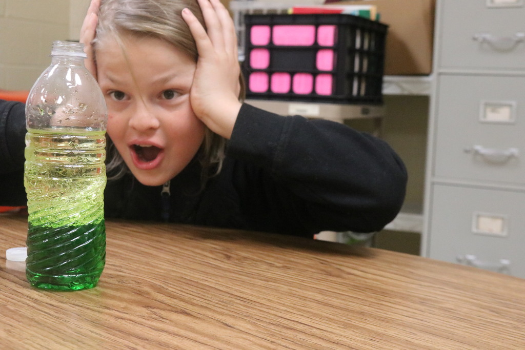 A boy at Science Club is shocked with his experiment.