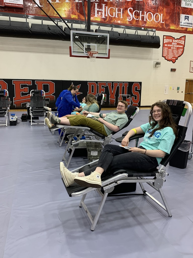 THS students smile as they donate blood.