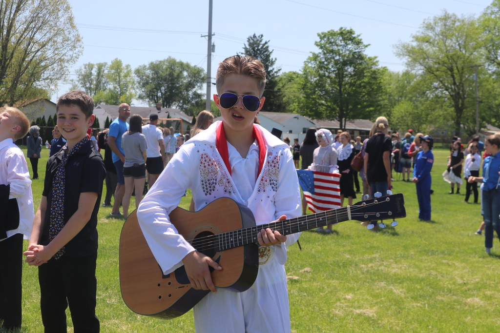 A 5th grade student dressed as Elvis Presley.