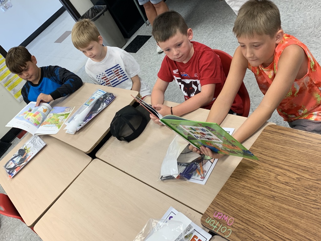 Reading to each other at summer school.