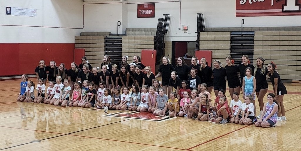 Cheerleaders with their little campers.
