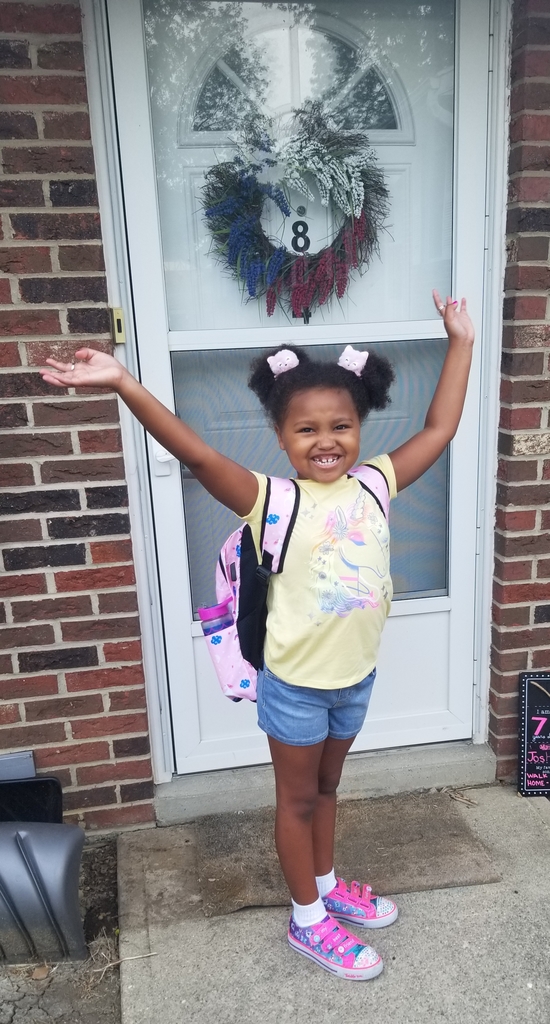 A first grader is thrilled to start the new school year.