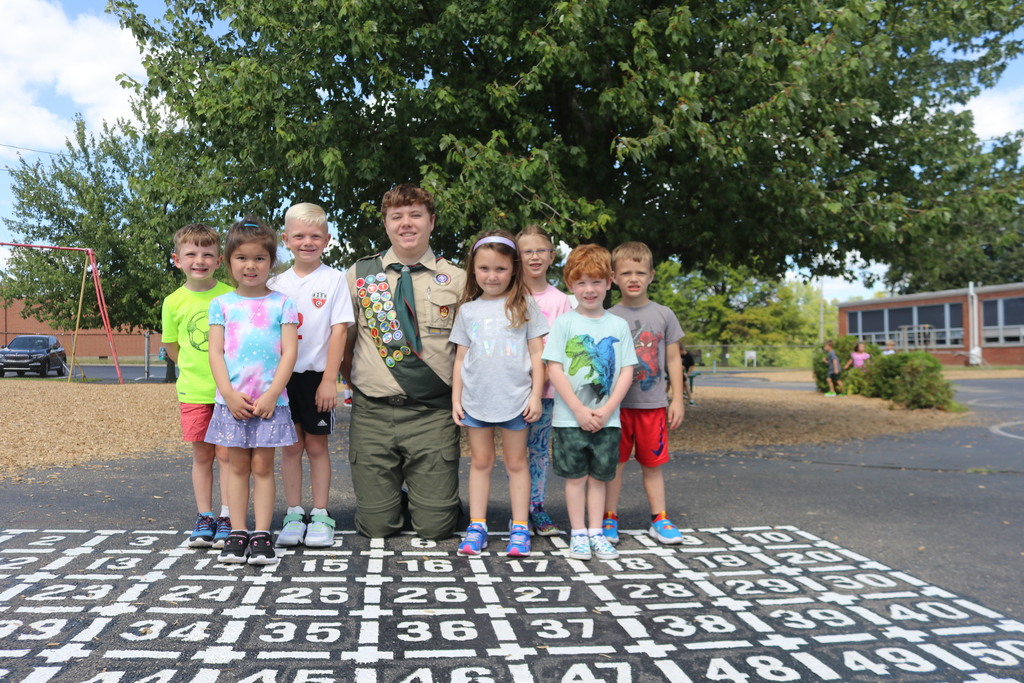 THS sophomore Ben Kozen poses with Nevin Coppock students to show off his Eagle Scout project.
