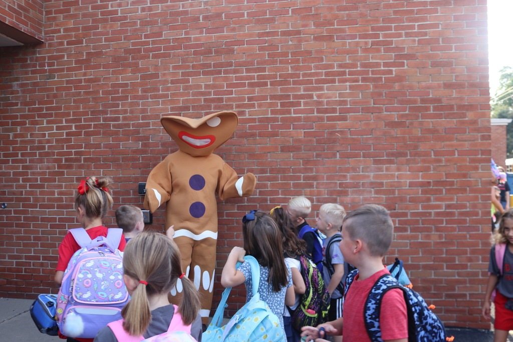 The gingerbread man greets students on their way into school this morning.