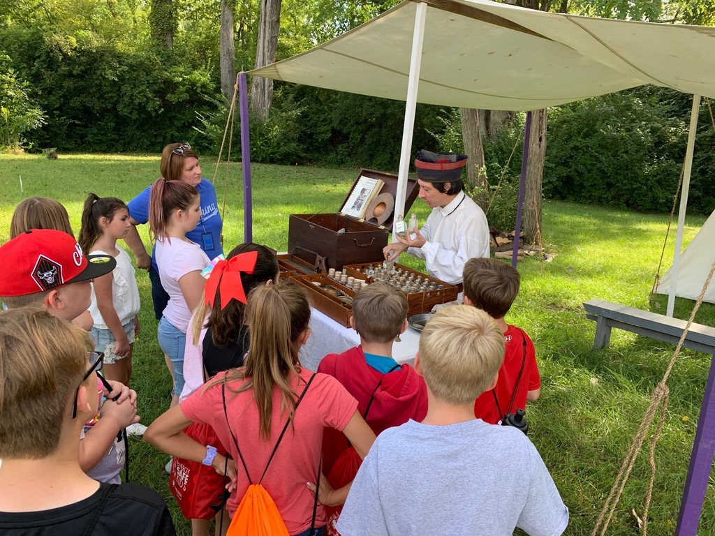 Students watch one of the pioneers at The Fair at New Boston
