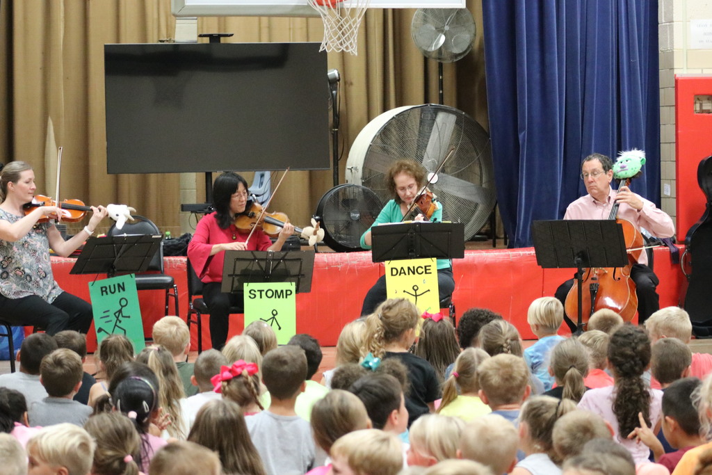 A string quartet performs at Nevin Coppock