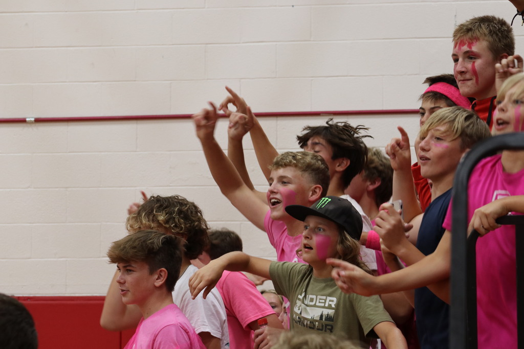 More students cheering for volleyball.