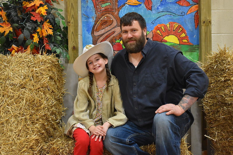 A dad and his daughter take time for a photo at the Hoedown.