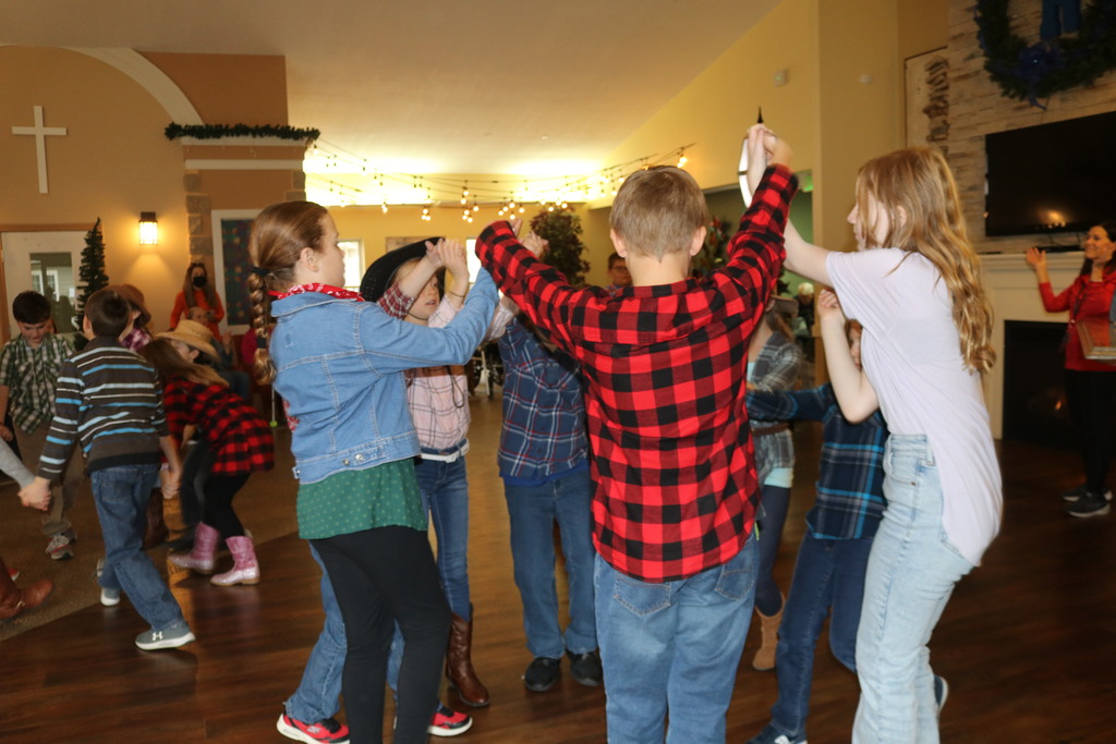 Students enter a circle for a square dance.