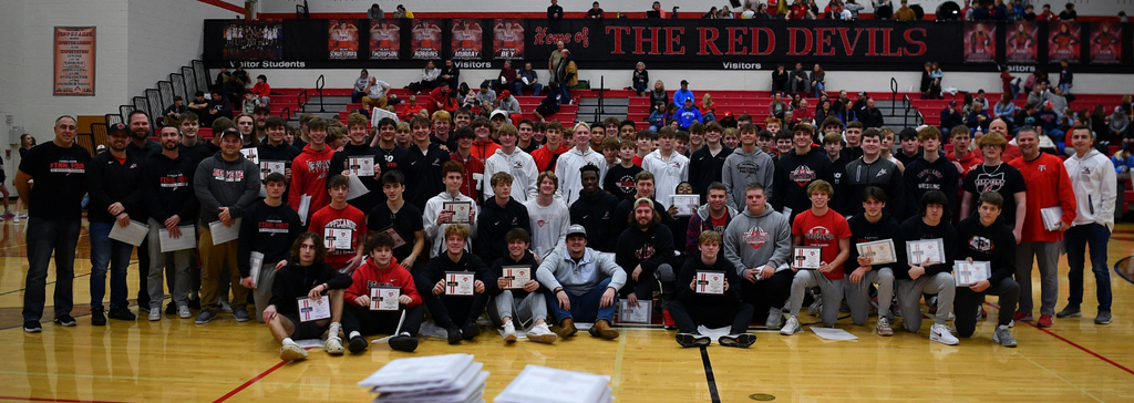 THS football team gets honored and awarded final four plaques at THS basketball game.