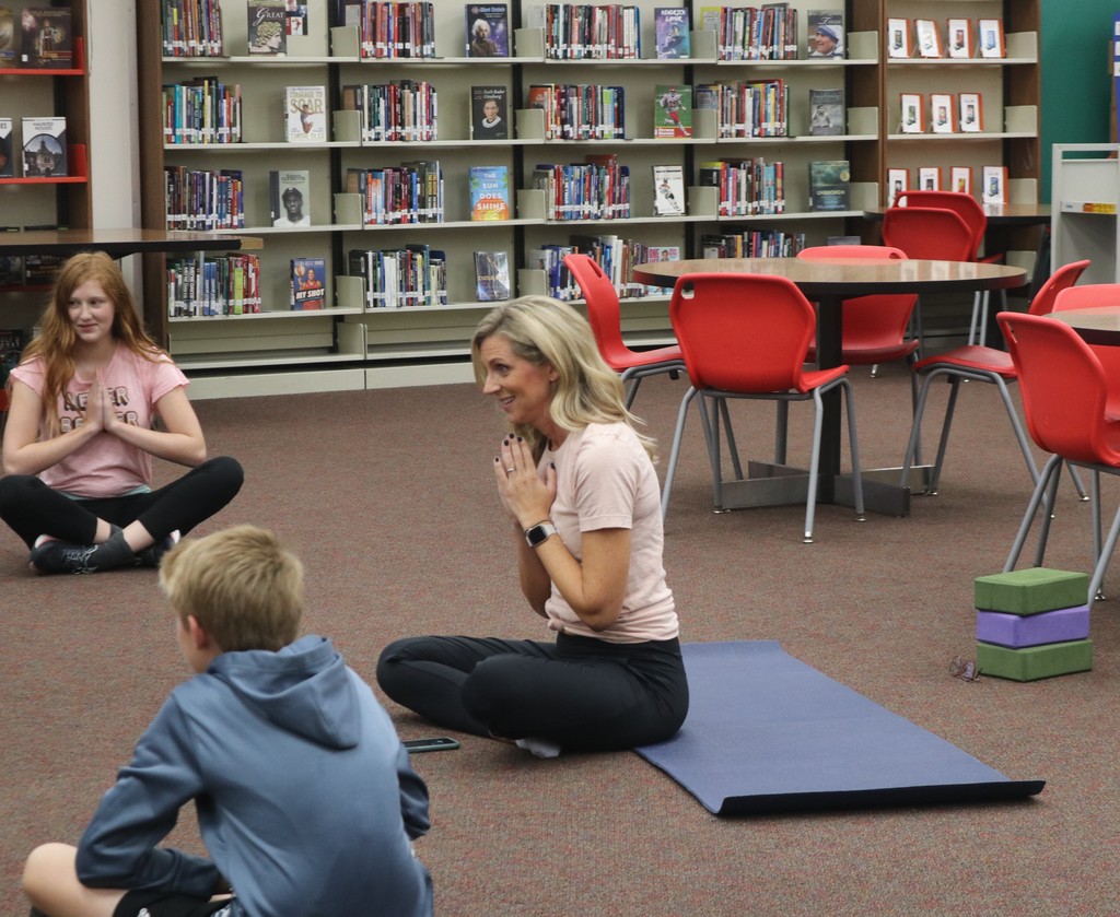 Sarah Gillenwater teaches yoga moves to students.