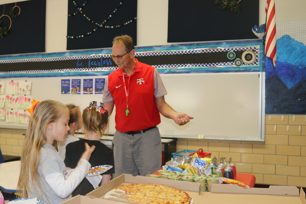 Mr. G talks with students.