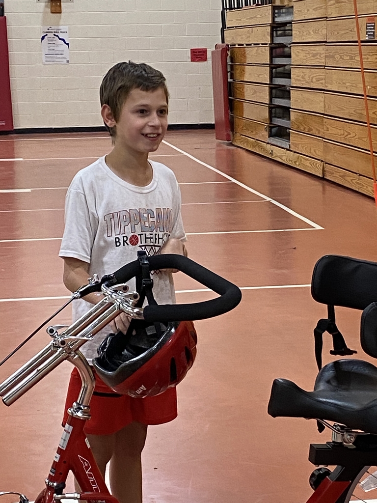 William is read to ride is happy to receive his new bike.
