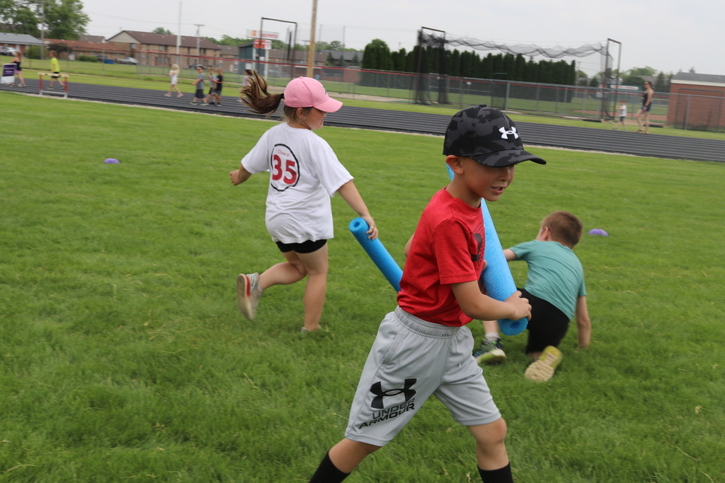 A boy plays a game at field day.