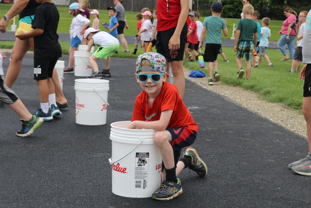 A boy gets ready to play a game at field day.  