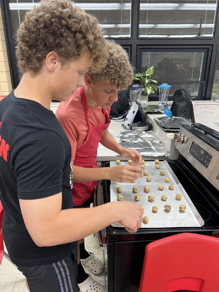 Two TMS students make cookies.