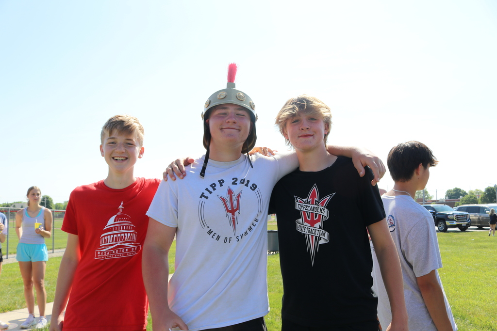 Three TMS act silly at Field Day.
