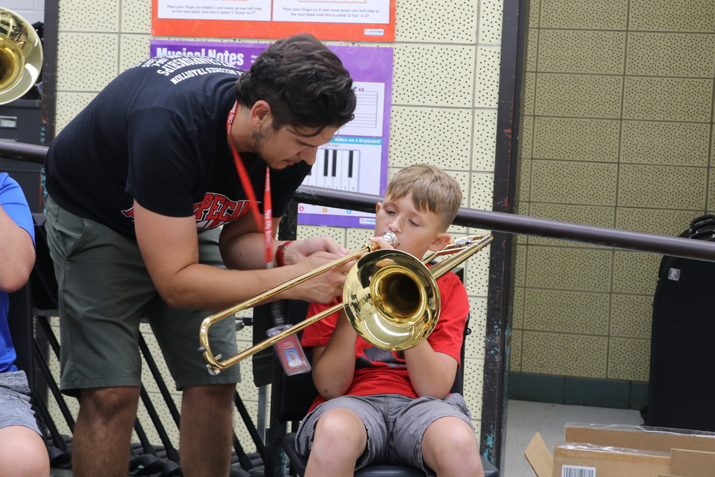Mr. Monath shows a student a better teghnique
