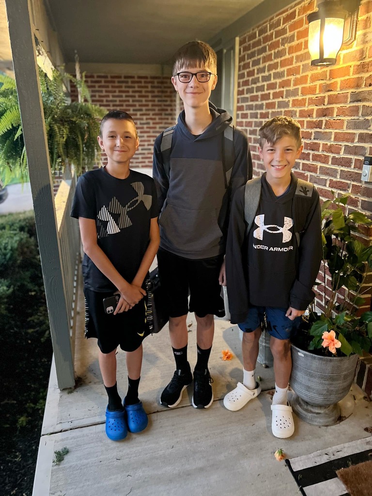 Three boys on their first day of school.