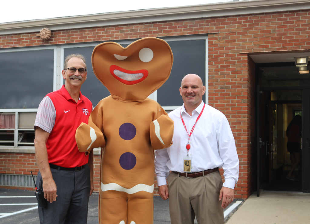 Gingerbread Man at Nevin Coppock with the principal and superintendent.