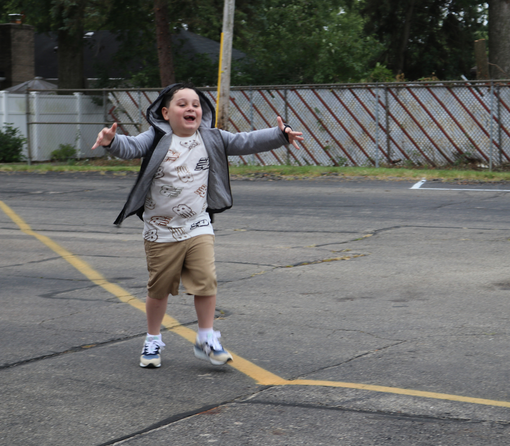 A student running with excitement.
