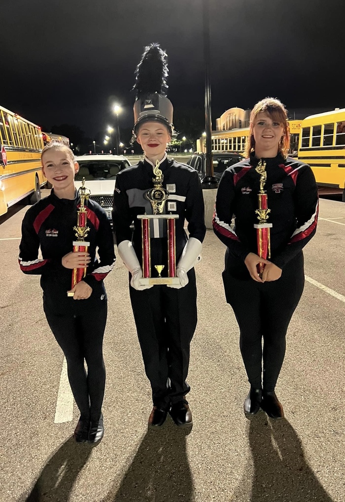 THS marching band holds three trophies.