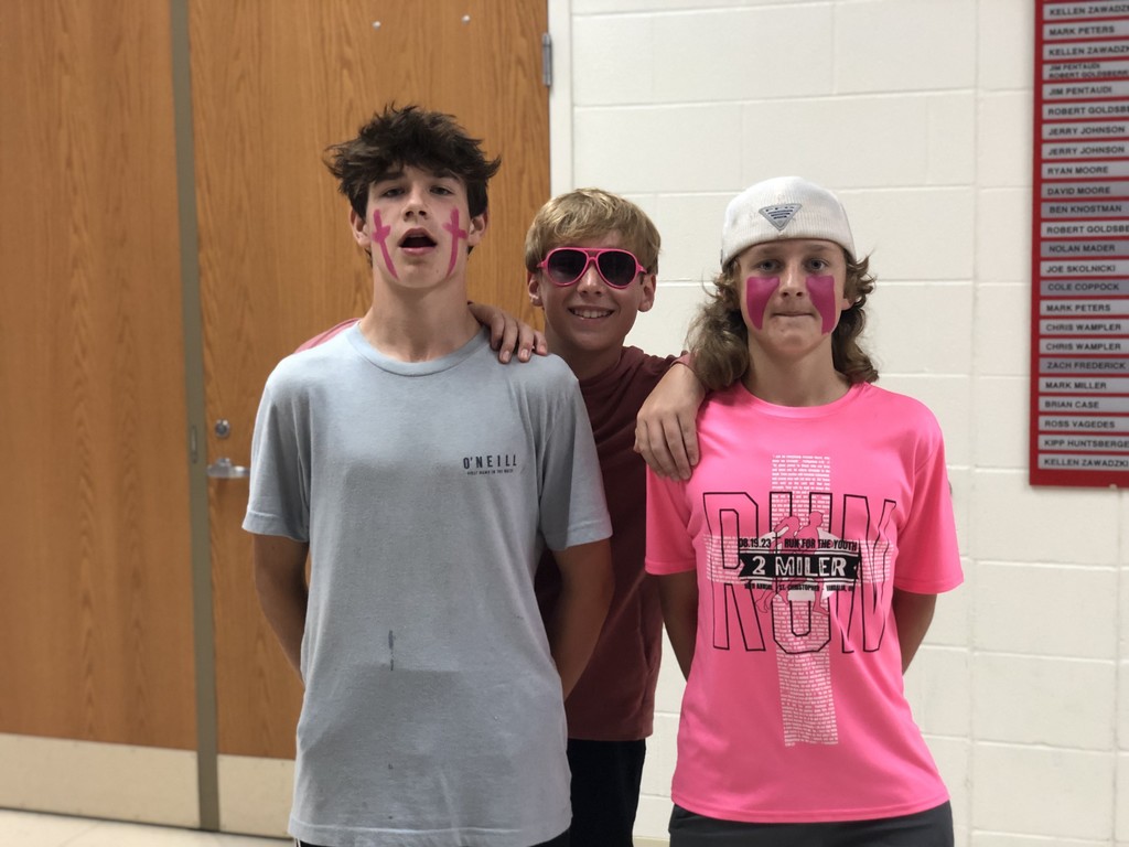 Three TMS fans dressed in pink.